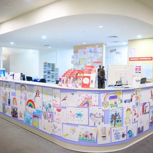 Main desk with collage of student illustrations at Pediatric ward in hospital